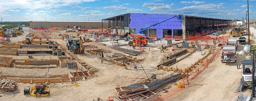 Large construction site with steel framing and equipment